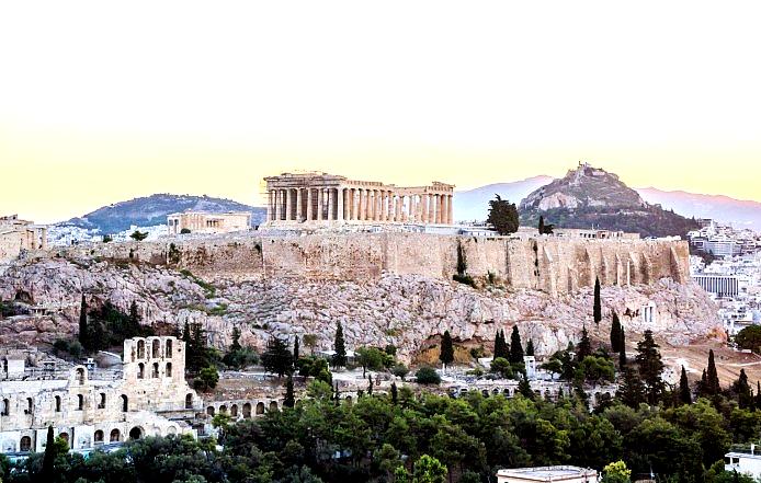 The Acropolis is an iconic hilltop ruin that houses ancient temples, including the Parthenon, overlooking Athens