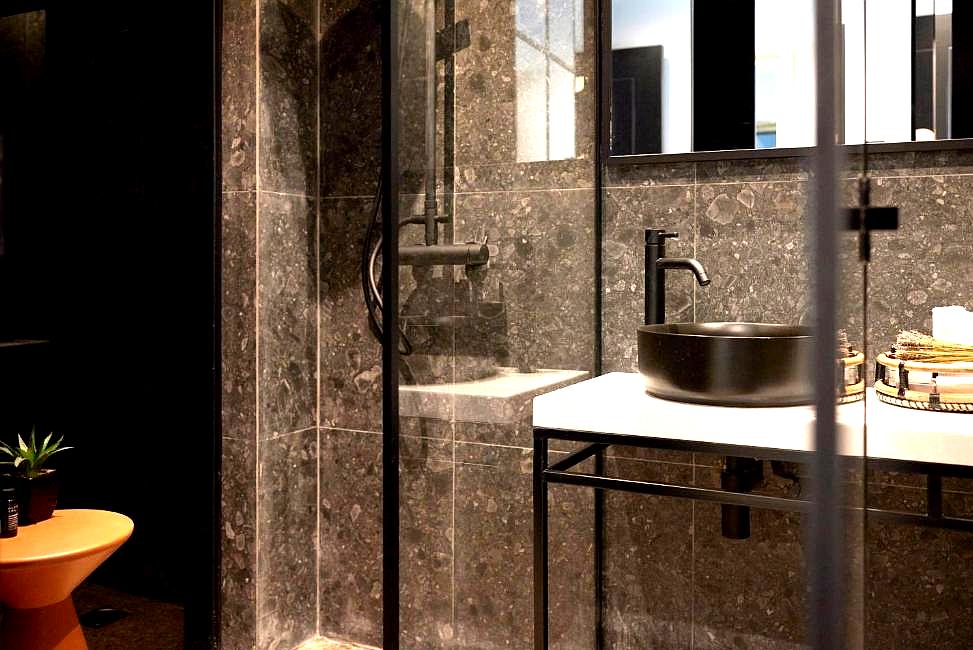 elegant bathroom with dark marble and modern fixtures