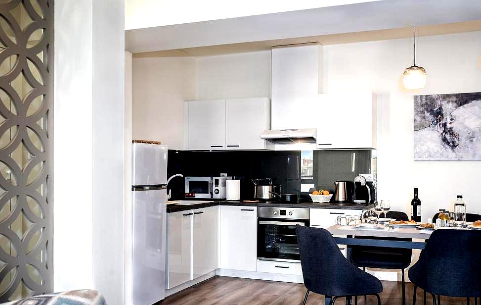 fully equipped kitchen in modern suite