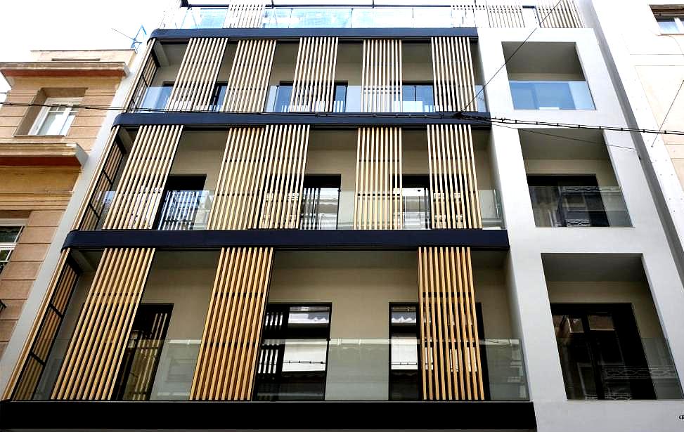 modern building exterior with wooden slats and balconies