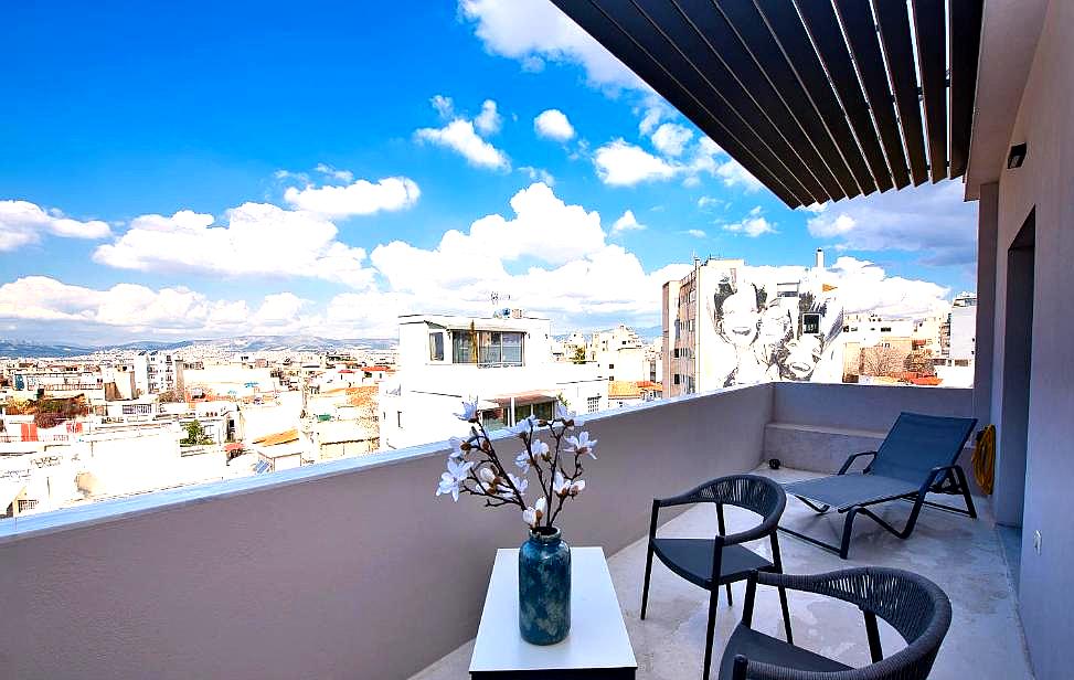 rooftop balcony with city view and lounge