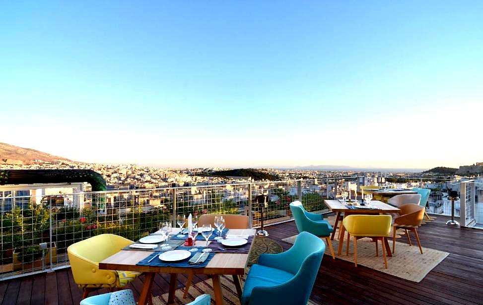 rooftop dining area with sea view and colorful seating