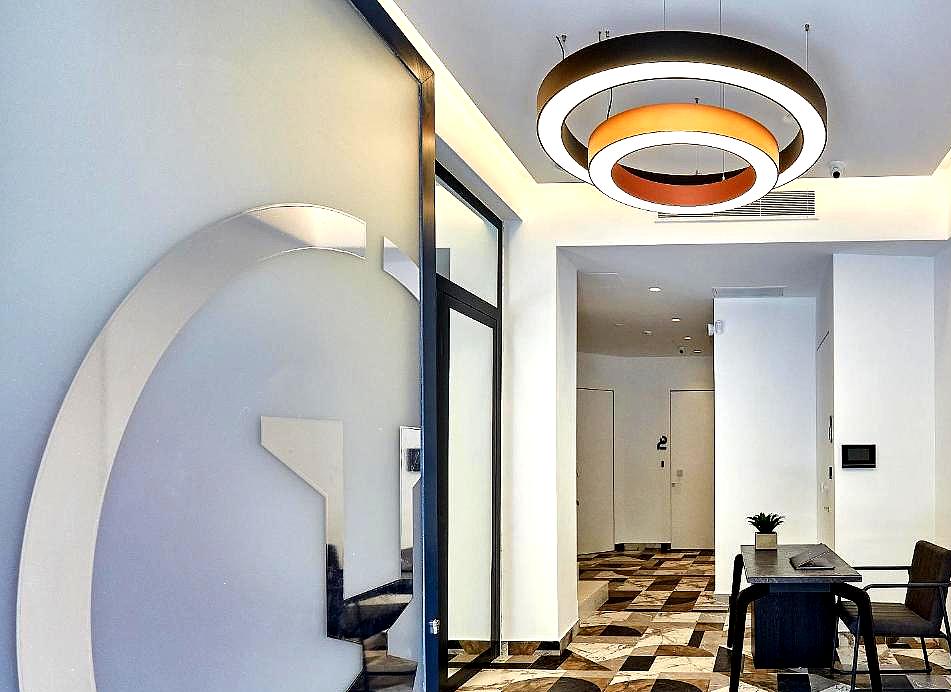 stylish hotel lobby with modern lighting and marble flooring