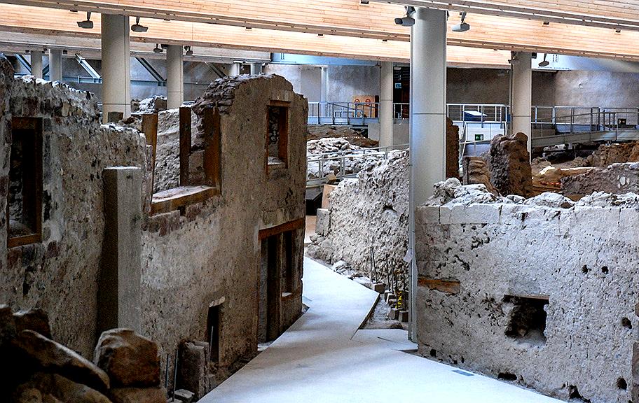 Akrotiri Archaeological Site is an ancient Minoan city preserved in volcanic ash, often called the 'Pompeii of the Aegean