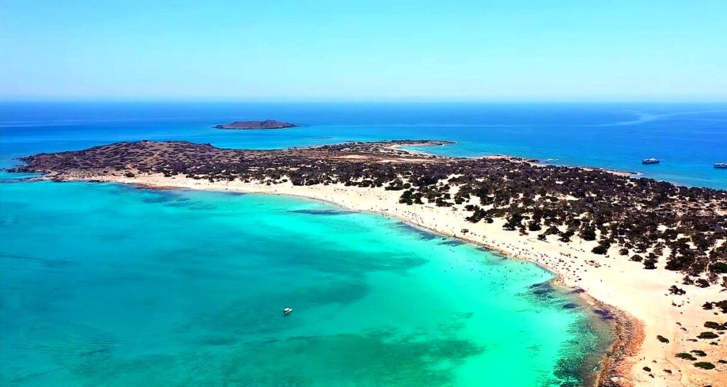 Chrissi Island is a paradise with turquoise waters, golden sand, and cedar forests, accessible by boat from Ierapetra