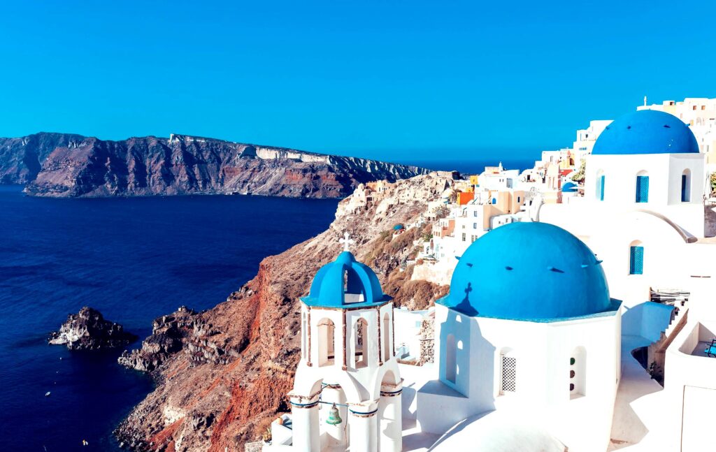 Fira is the capital of Santorini, perched on the edge of a cliff, offering stunning views of the caldera and sunset