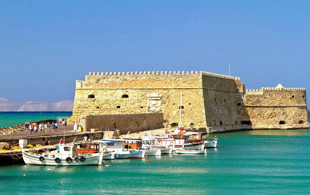 Koules Fortress is a massive Venetian stronghold guarding the old harbor, offering historical exhibits and sea views