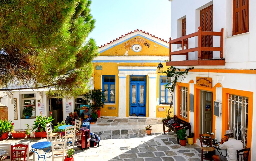 Lefkes is a traditional mountain village with cobblestone streets, stone houses, and spectacular views of the surrounding countryside