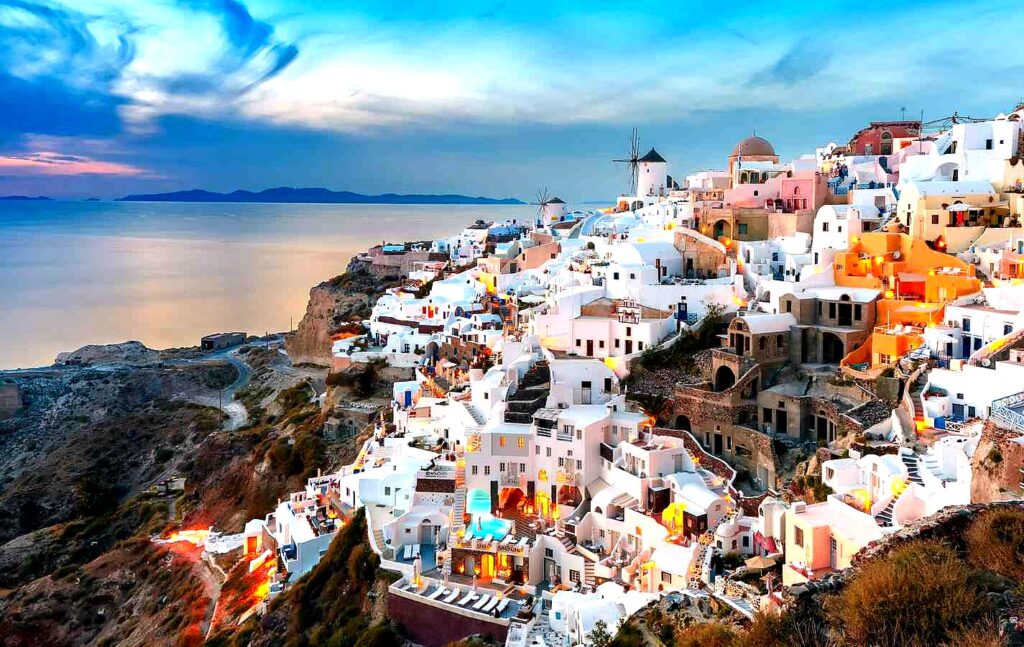 Oia is a picturesque village known for its whitewashed houses, blue domed churches, and breathtaking sunsets