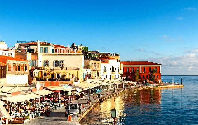 The Old Venetian Harbor in Chania is a picturesque spot with an iconic lighthouse, cafés, and stunning sunset views