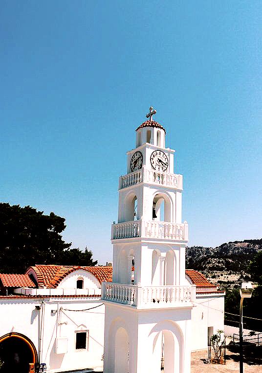 Tsambika Beach and Monastery offers a sandy beach with crystal clear waters, overlooked by a historic monastery on a hill