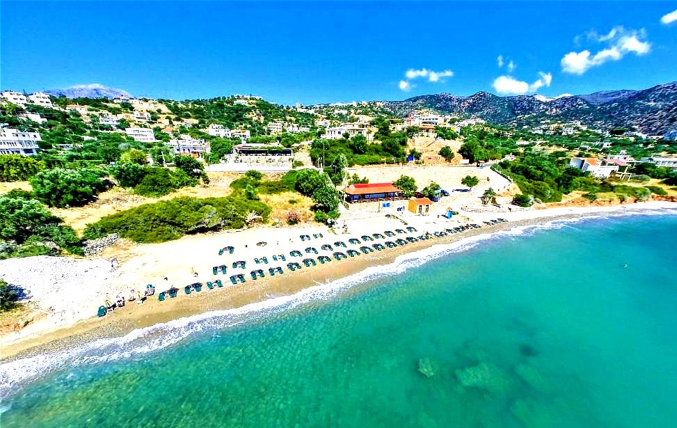 aerial view of beachfront with sunbeds