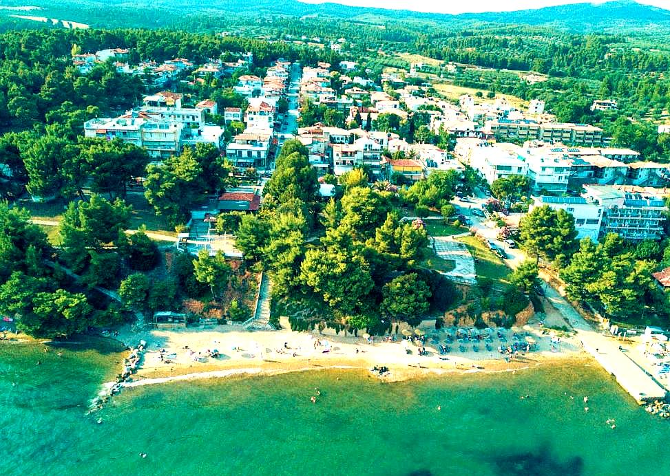 aerial view of hotel resort with beachfront location and lush surroundings