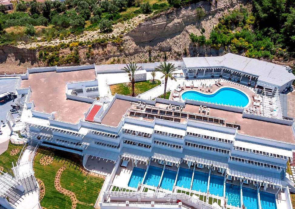 aerial view of hotel with pool and cabanas