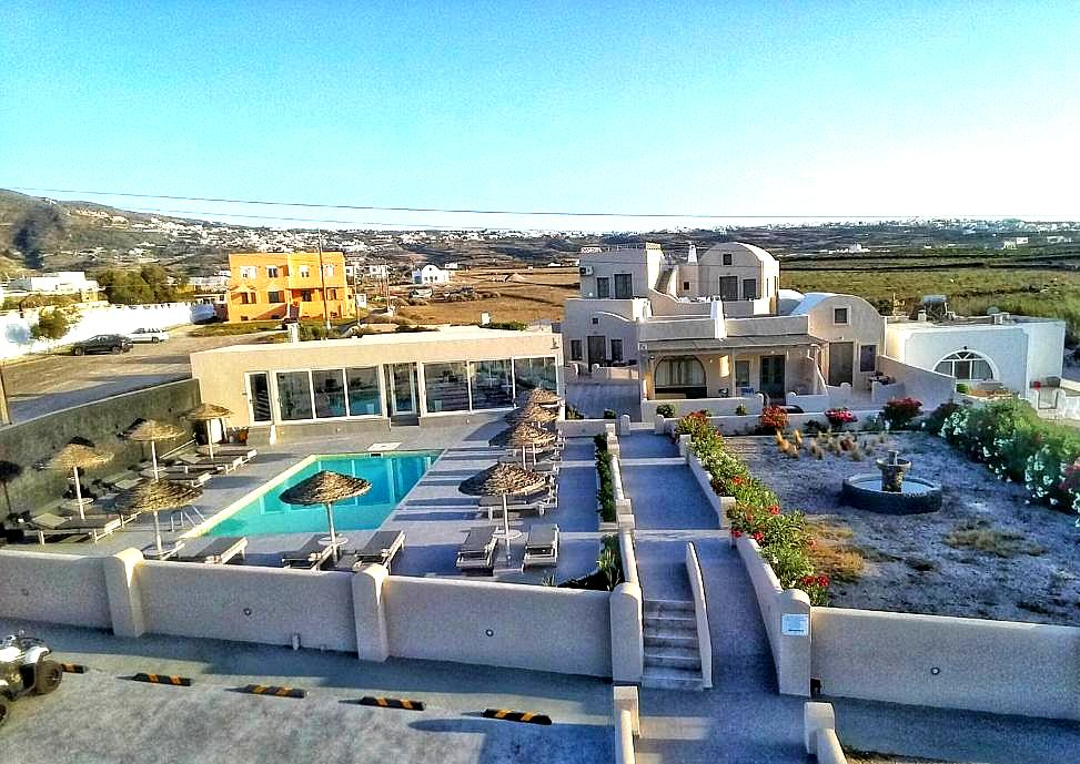 aerial view of hotel with pool and garden