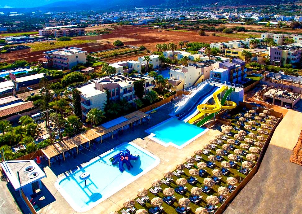 aerial view of hotel with water park and pools