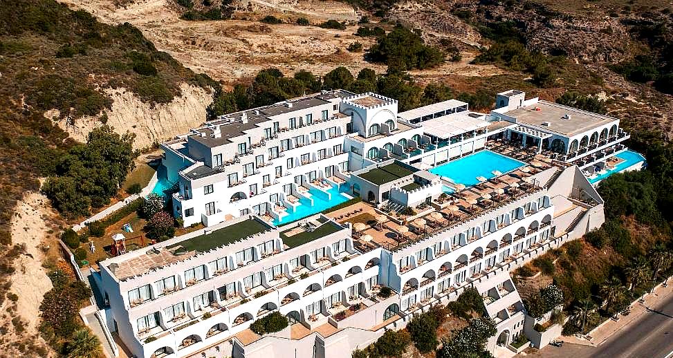 aerial view of large resort with multiple pools