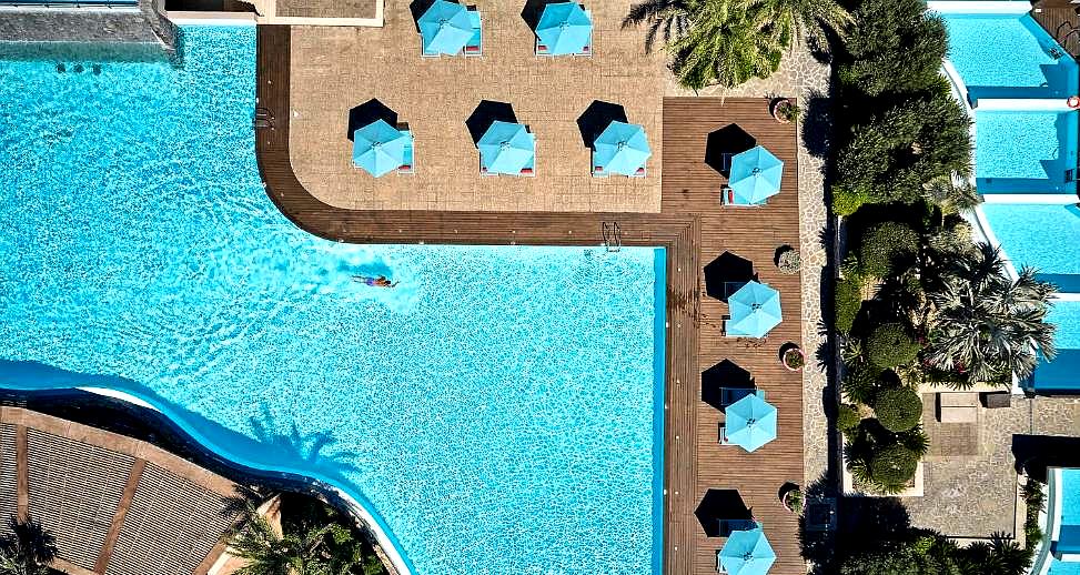 aerial view of pool area with umbrellas