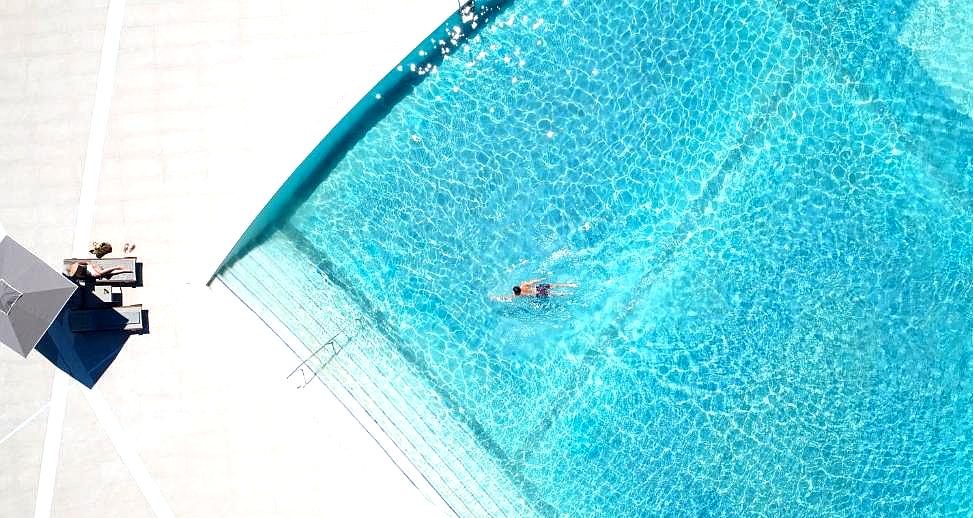 aerial view of swimming pool with lounge area