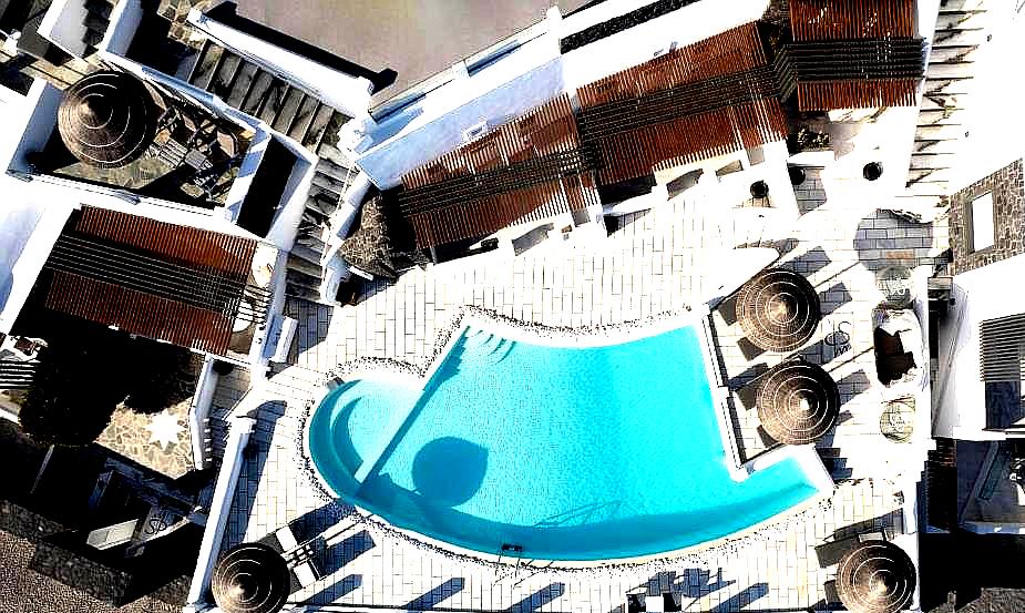 aerial view of swimming pool with loungers