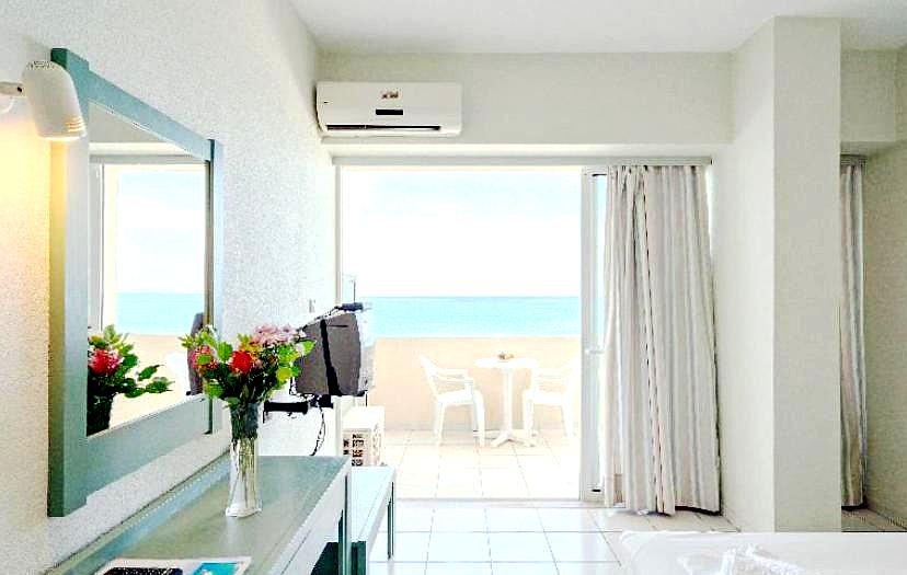 airy bedroom with sea view balcony and natural light