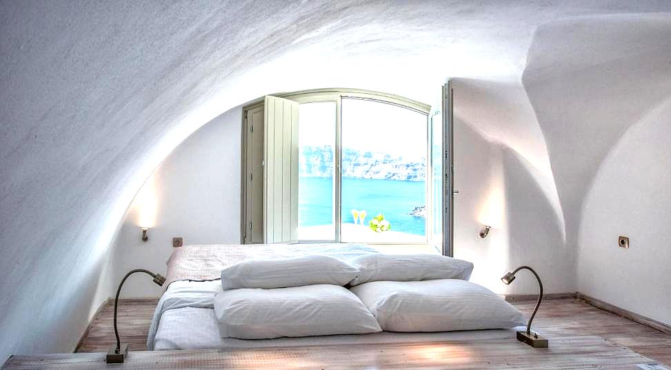 arched bedroom with sea view