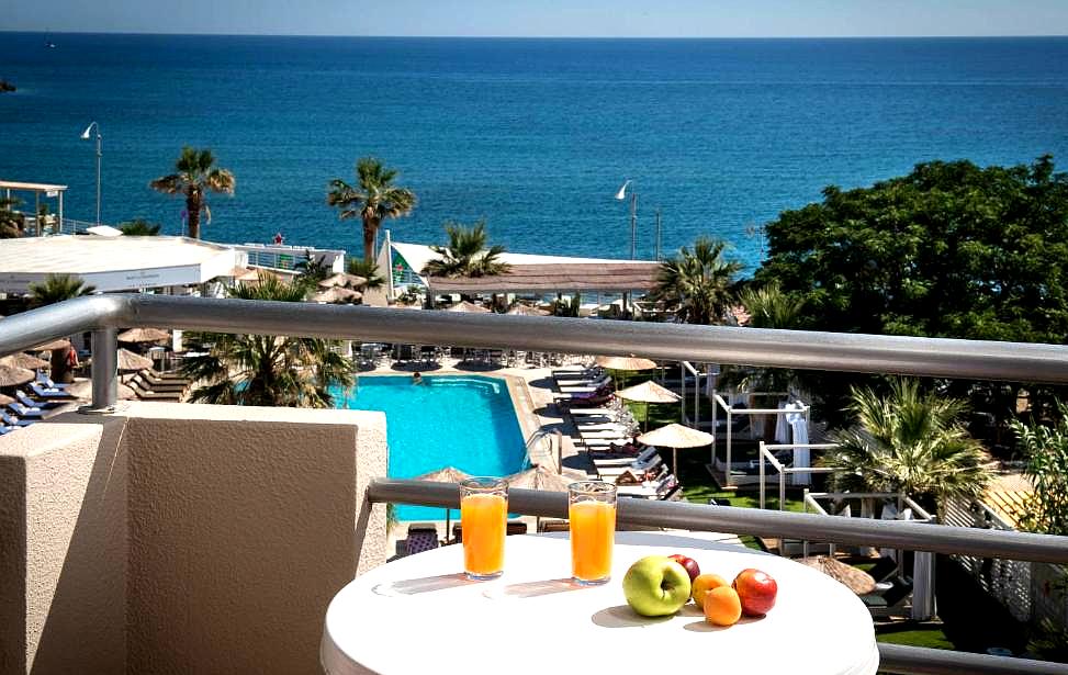 balcony view overlooking pool and sea