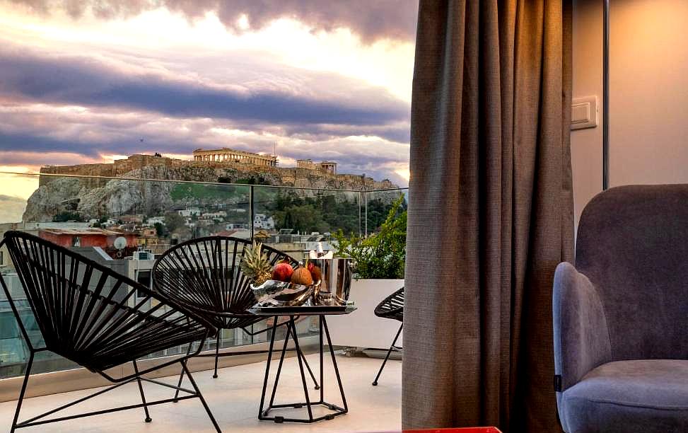 balcony with acropolis view and cozy seating area