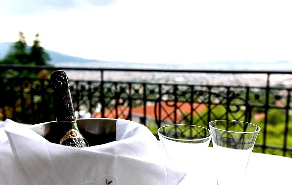 balcony with champagne and city view