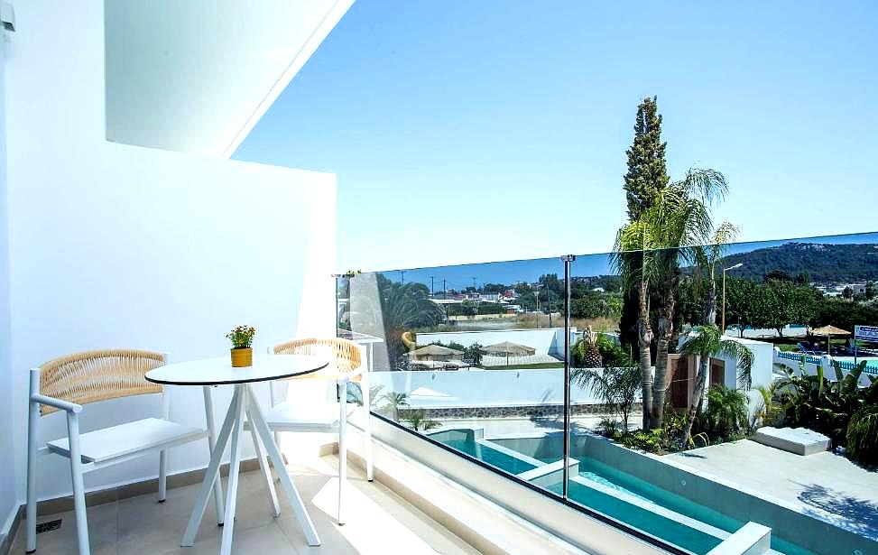 balcony with seating and pool view