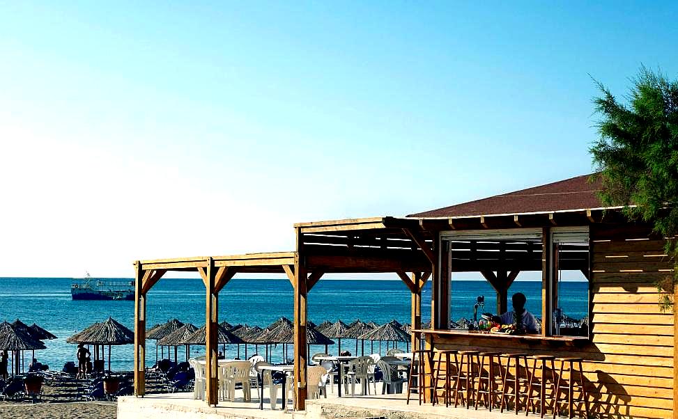 beachfront bar with sea view and sun loungers