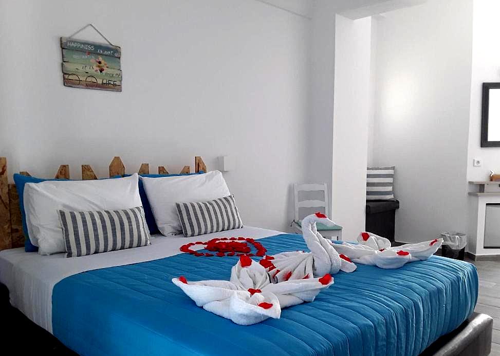 bedroom with decorative towel swans