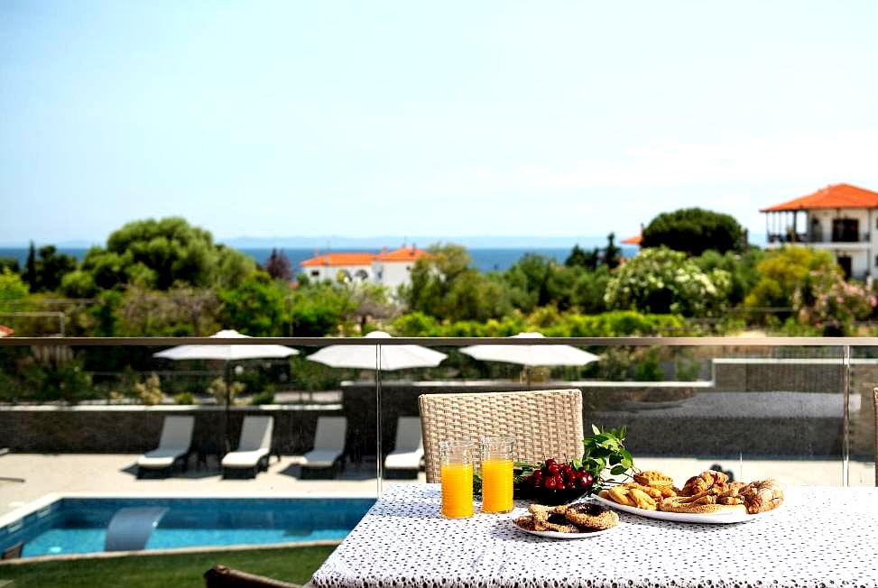 breakfast table with sea view by the pool