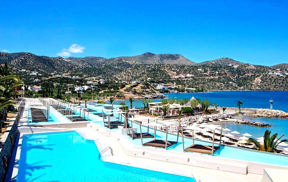 breathtaking pool area overlooking a beautiful bay and mountains