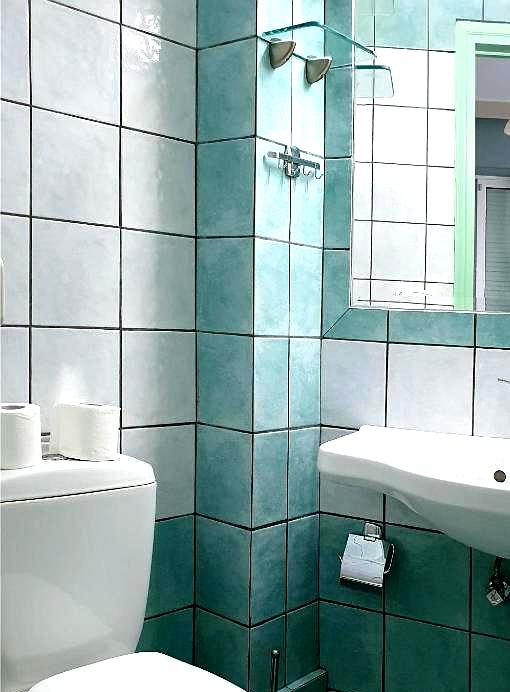 bright bathroom with colorful tiled walls and modern fixtures