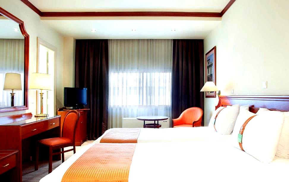 bright hotel room with classic furniture