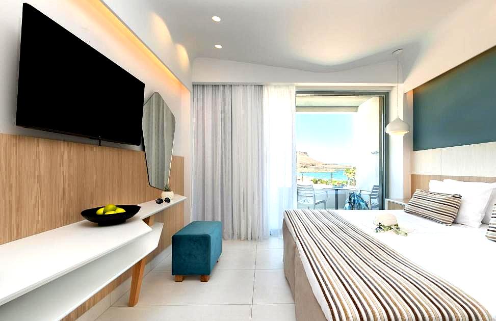 bright modern hotel room with sea view balcony