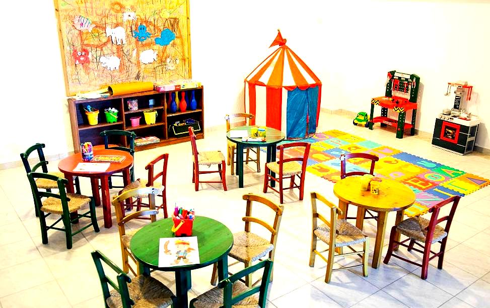 bright room with colorful tables and chairs for children