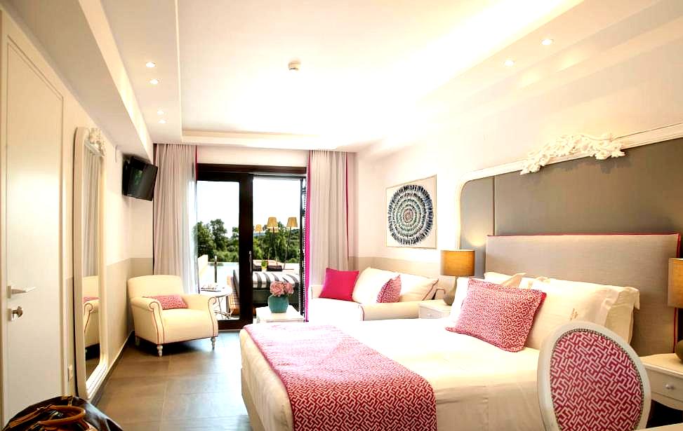 bright room with pink accents and balcony