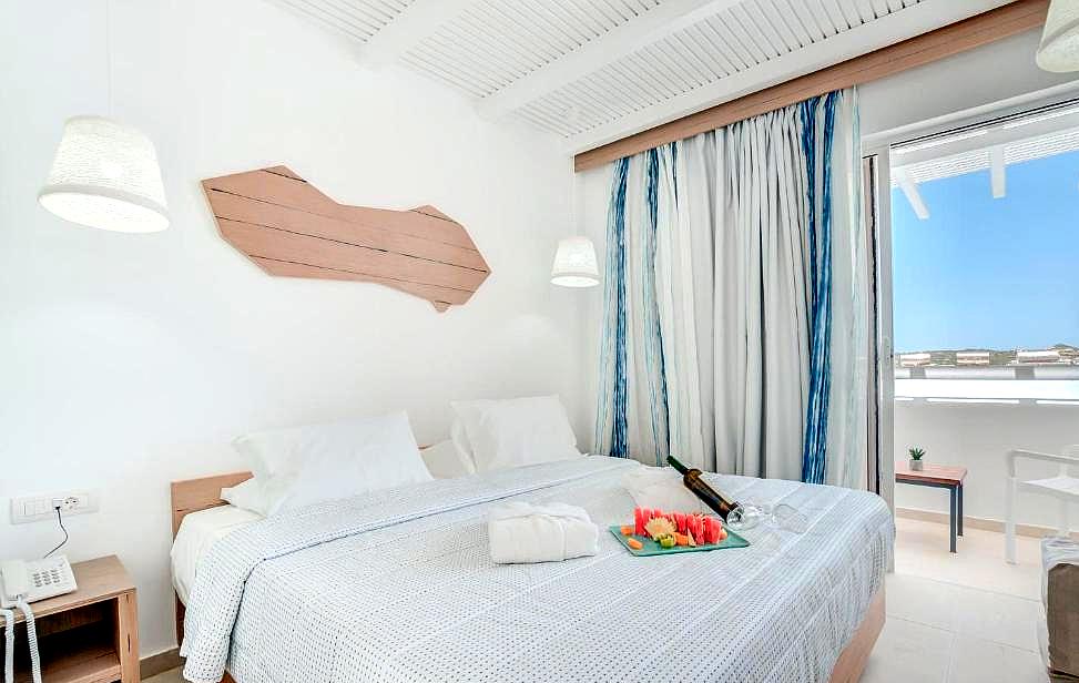 bright sea view room with balcony and modern decor