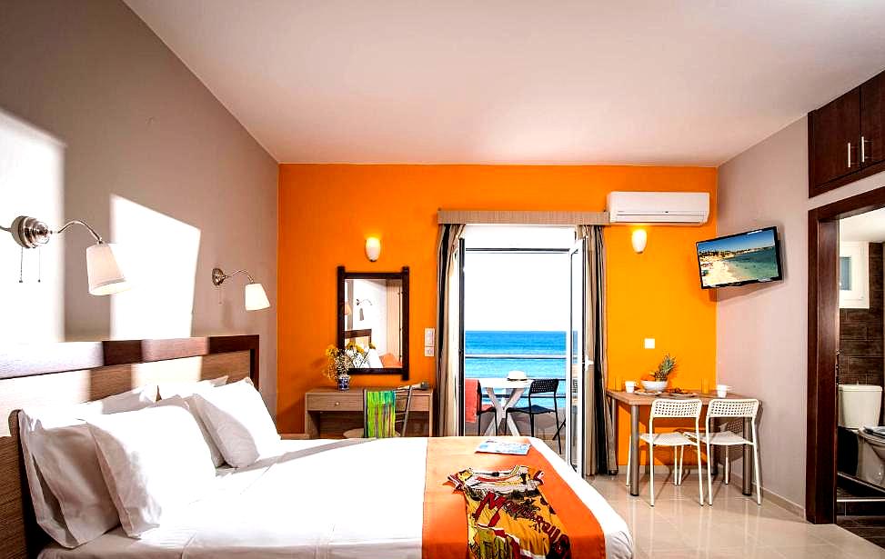 bright sea view room with orange accent wall