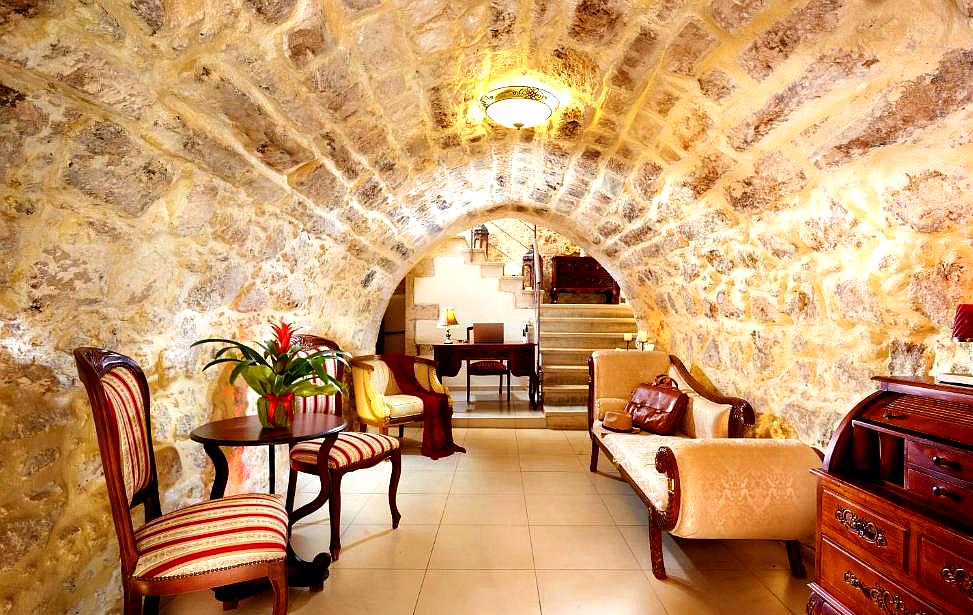 charming lounge area with stone arched ceiling and classic furniture