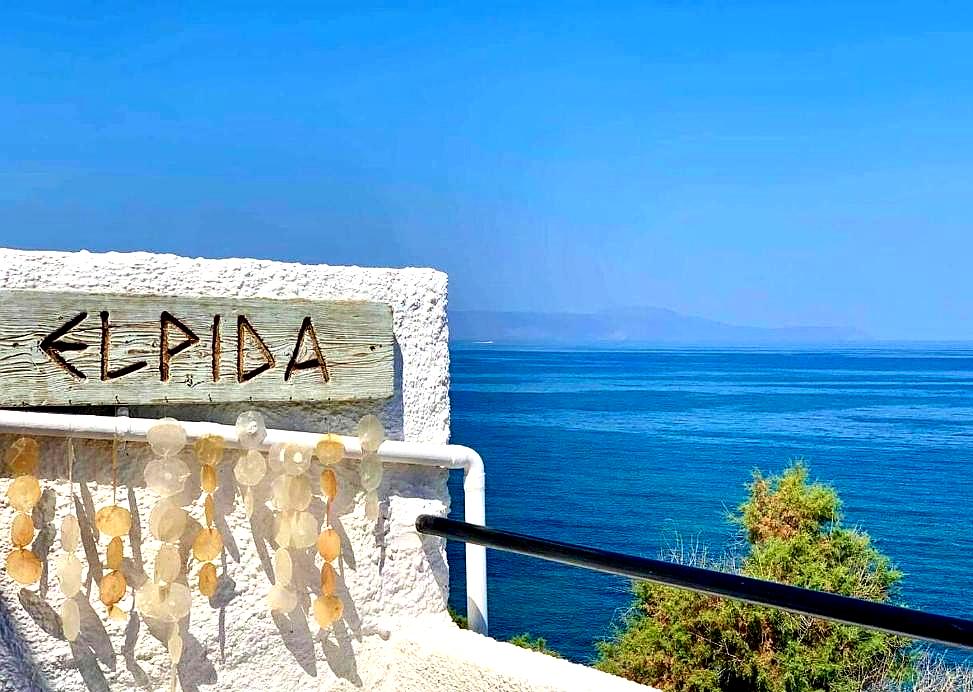 charming sign and decorative shells overlooking the sea