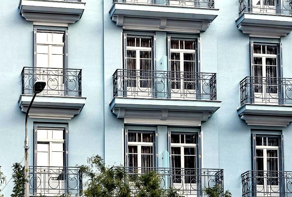 classic hotel exterior with balconies and large windows