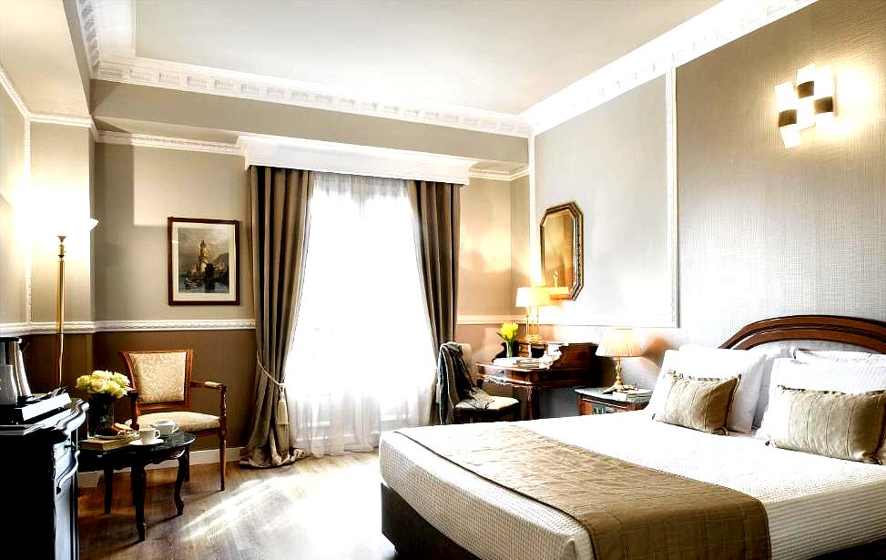 classic hotel room with elegant furnishings and warm lighting