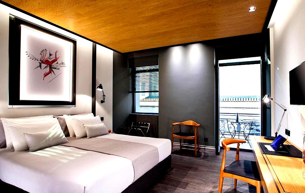 contemporary suite bedroom with wooden ceiling