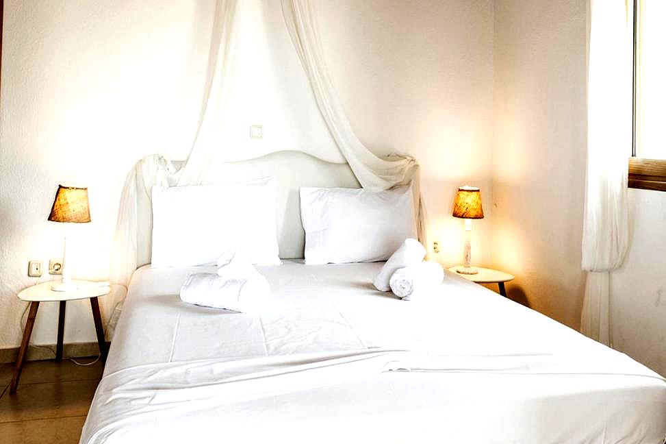 cozy bedroom with soft lighting and crisp white linens