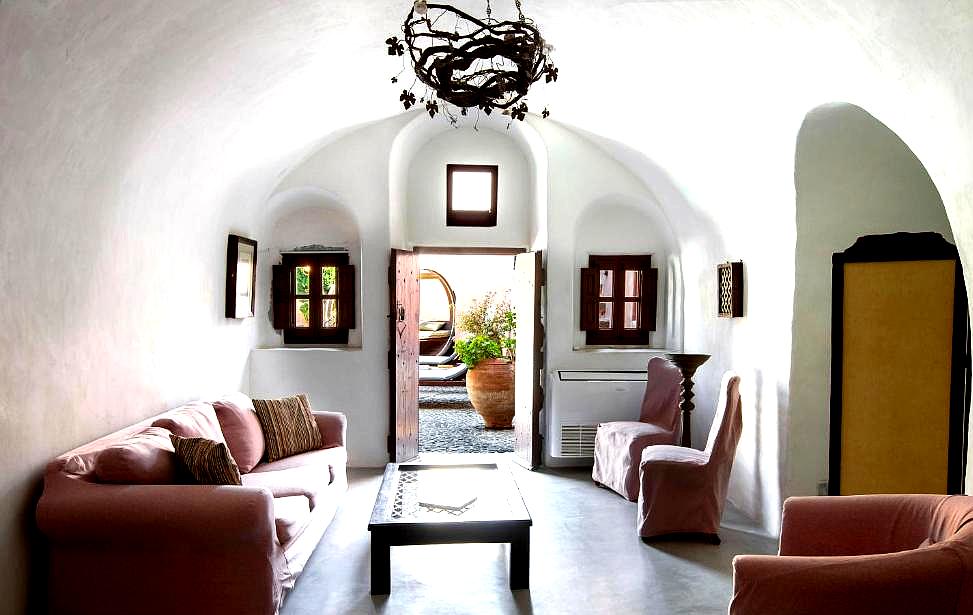 cozy lounge with arched ceiling and rustic decor