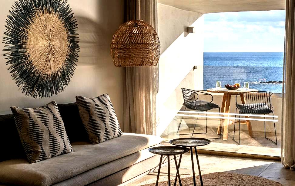 cozy lounge with sea view balcony and woven decor