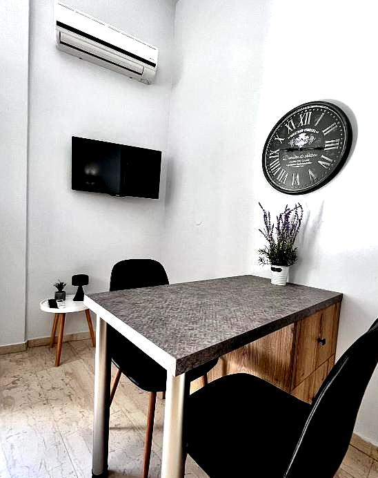 cozy meeting room with modern decor air conditioner and wall clock